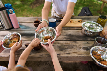 Picnic Gathering with Family Sharing Meals Outdoors in Nature