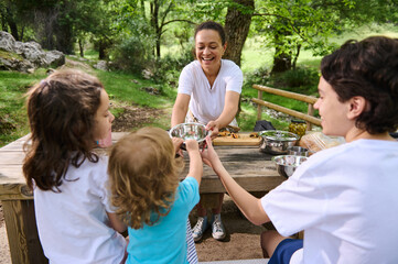 Family Enjoying a Picnic in a Scenic Mountain Forest Location