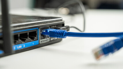The internet cable is plugged into the router. 