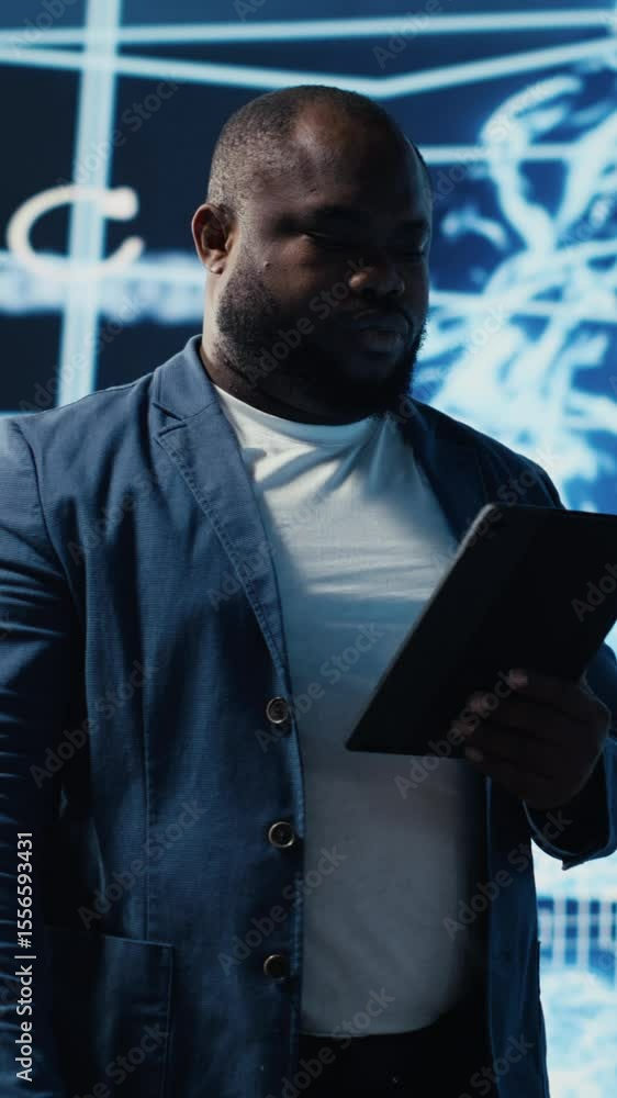Poster vertical video young black technician reviewing ai data visualization and neural networks platforms,