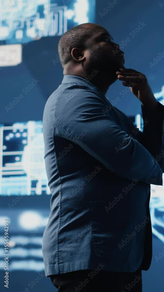 Poster vertical video african american businessman studying digital ai brain interface, symbolizing neural 