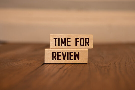 Wooden blocks and the inscription TIME FOR REVIEW