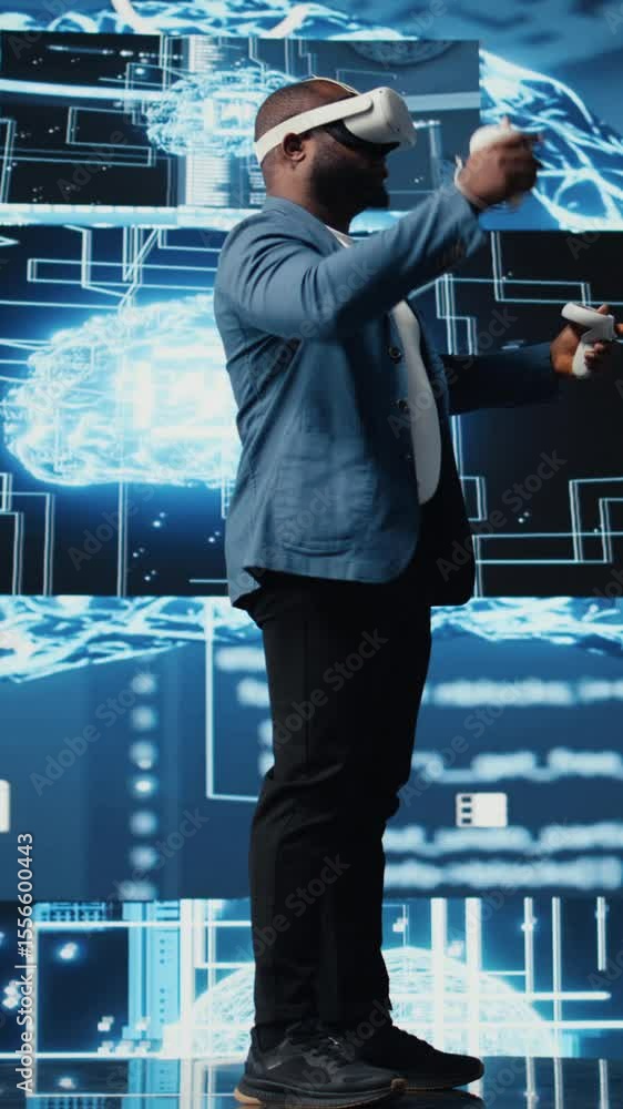 Poster vertical video young african american engineer focused on vr headset programming and analytics, surr