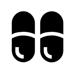Cozy black slippers silhouette on a white background for home footwear concept