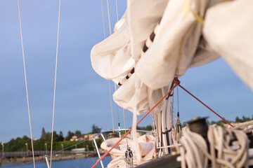 sailboat yacht with closed sails