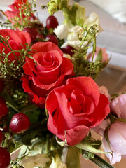 Red Roses with Berries in Floral Arrangement