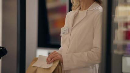 Health care worker woman pharmacist talk in pharmacy medical help advice customer buying pills medication package at cashier counter smiling girl medicine service drugstore pay contactless credit card