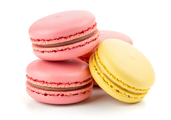 Obraz premium Close up of delicious pink and yellow macarons stacked on a white background