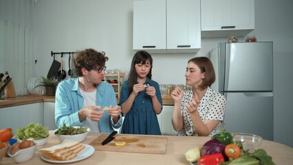 Happy father move to music while cooking food and prepare lunch at modern kitchen. Active dad...