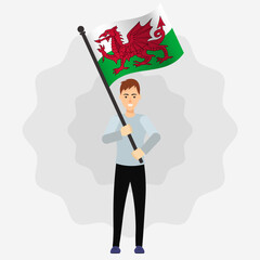 Happy Man Holding Wales Flag