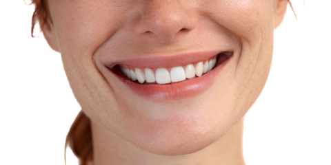 Closeup of a smiling Caucasian woman showcasing perfect white teeth and healthy gums Concept of dental care, cosmetic dentistry, and confident smile