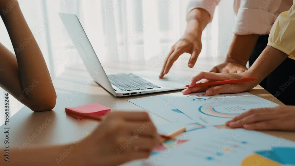 Poster startup company employee working together using laptop analyzing bi dashboard paper on financial dat