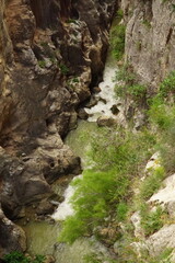 The famous El Caminito del Rey in Malaga with its amazing views with trees, mountains, river and a...