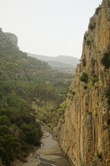 The famous El Caminito del Rey in Malaga with its amazing views with trees, mountains, river and a...