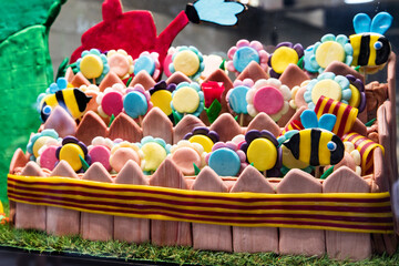 Abundance of caramel with colorful sweets flowers with candies