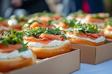 Close-up of a gourmet bagel topped with cream cheese, smoked salmon, and fresh green vegetables – a savory breakfast delight.