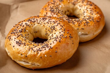 Close-up of a gourmet bagel topped with cream cheese, smoked salmon, and fresh green vegetables – a savory breakfast delight.