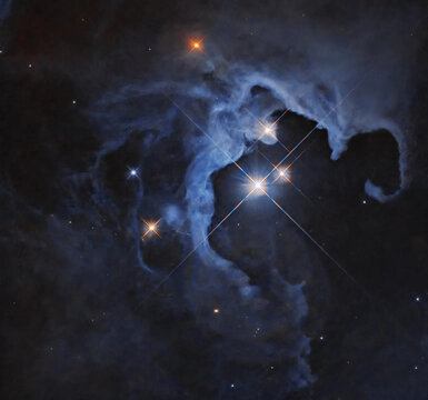 Stunning reflection nebula with bright stars and cosmic dust clouds. Image courtesy of NASA.
