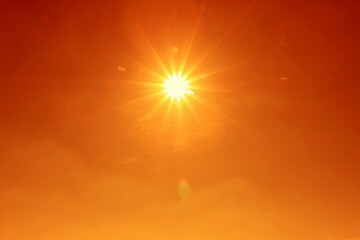 Bright sun in orange sky during hot summer weather. Extremely high temperature