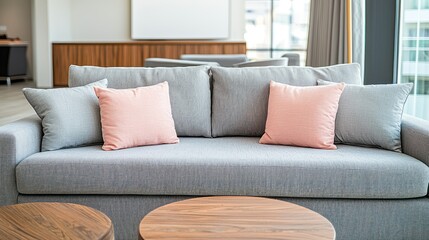 Cozy couch with pink pillows, warm light