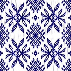 ikat pattern seamless with indigo floral elements and ethnic geometric design. Perfect for textile,...