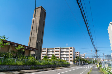 housing complex and water tower are located on the outskirts of Fukuoka City, Japan.