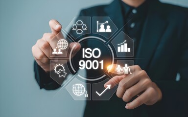 Business professional interacting with a digital interface displaying iso 9001 certification and various business process icons representing quality management and global standards