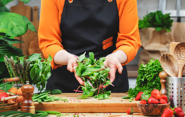 dedicated chef showcases a variety of fresh vegetables, highlighting a commitment to healthy vegan...