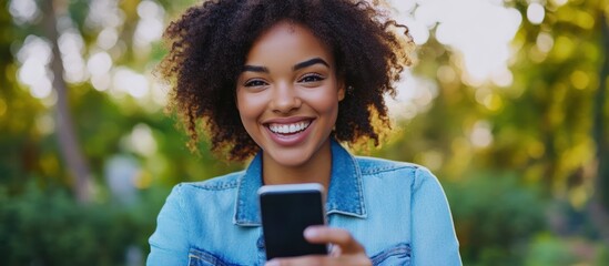 Happy woman using phone outdoors