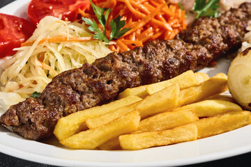 Lamb kebab with grilled vegetables, bright rustic lighting, overhead composition, Turkish grill...