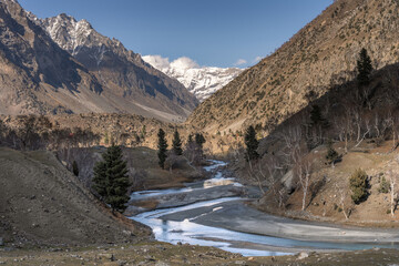 Mountain Stream Winding Through Bare