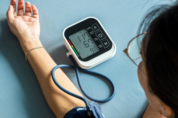 Man check blood pressure monitor and heart rate monitor with digital pressure gauge. Health care...