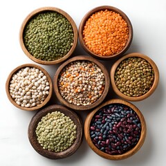 Assortment of dried legumes in wooden bowls