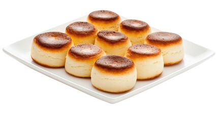 Freshly Baked Round Desserts on White Plate with Light Brown Tops for Sweet Treat Lovers