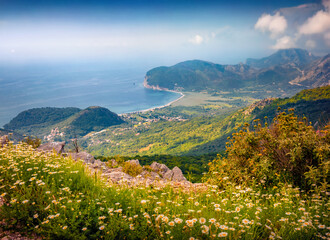Astonishing morning seascape of Adriatic sea with Petrovac town on background. Breathtaking summer view of Montenegro countryside. Beauty of nature concept background.