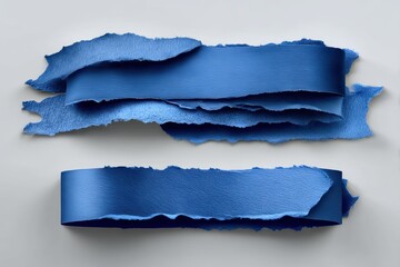 Two ripped blue paper strips on light background