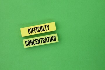 Colored paper with the word difficulty concentrating. the inability to focus on a task or activity...
