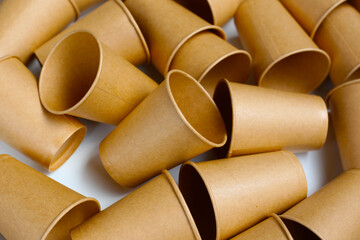 Brown paper cups on white background.