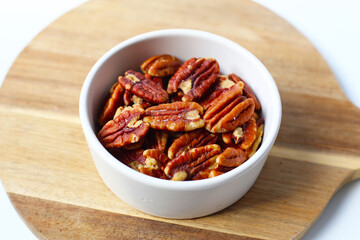 Delicious salted pecan nuts scattered.