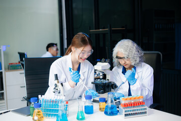 Scientists in lab coats collaborating with test tubes, flasks, and microscopes in a modern lab.