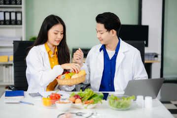 Doctors sharing fresh vegetables, promoting health and nutrition. Ideal for wellness, healthcare, and science themes.