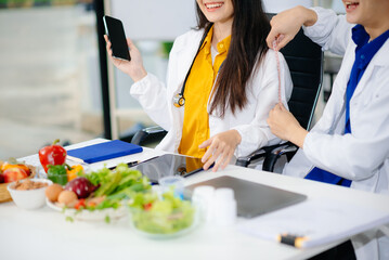 Doctors sharing fresh vegetables, promoting health and nutrition. Ideal for wellness, healthcare,...