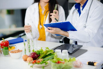 Doctors sharing fresh vegetables, promoting health and nutrition. Ideal for wellness, healthcare,...
