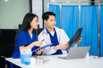 Professional healthcare team consultation a doctor and nurse collaborating in a clinic, discussing...