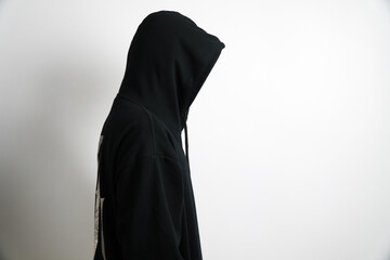 Person in Black Hoodie with Head Down