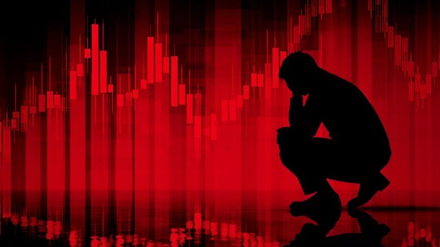 A man is kneeling down in front of a red background. The background has a series of lines and the man is looking at the ground
