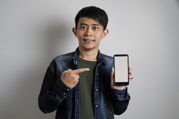 a man showing smartphone screen
