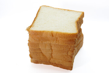 A stack of eight white bread slices against a white background.