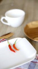 Red chilies on white plate