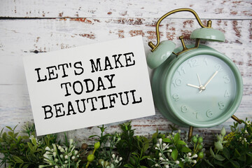 Let's make today beautiful text message motivational and inspiration quote top view on wooden...